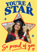 A red-outlined star photo frame fills a bright yellow background, with blue serif wording, red script and little blue sparkles.