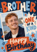 Oversized cut-paper-style lettering sits above a tilted white photo frame, with a cream starburst, orange birthday banner and scattered stars on navy and blue.