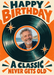 A dark green vinyl record forms a circular photo frame on cream, with orange starbursts and bold retro block lettering.