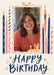 Tall navy and coral patterned candles flank a wavy portrait photo border tied with a bow, above flowing navy birthday lettering on cream.