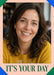 Green and blue triangular corners accent a peach border around a large portrait photo, with dark green serif wording below.