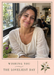 A slim green double border frames a large portrait photo on peach, with a small white floral sprig and spaced green serif wording below.