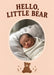 A small brown teddy bear sits beneath a cream-edged oval photo on peach, with tiny hearts and bold brown slab-serif welcome wording.