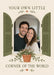 An arched window with olive-green shutters forms a photo frame on cream, with a trailing potted plant, small hearts and green serif wording.